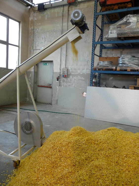 Conveyor pipe and maize flakes from Steam flaking mill for cereals and pulses